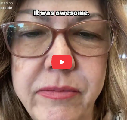 Close-up of a woman wearing glasses with text overlay saying It was awesome. YouTube play button in the center.