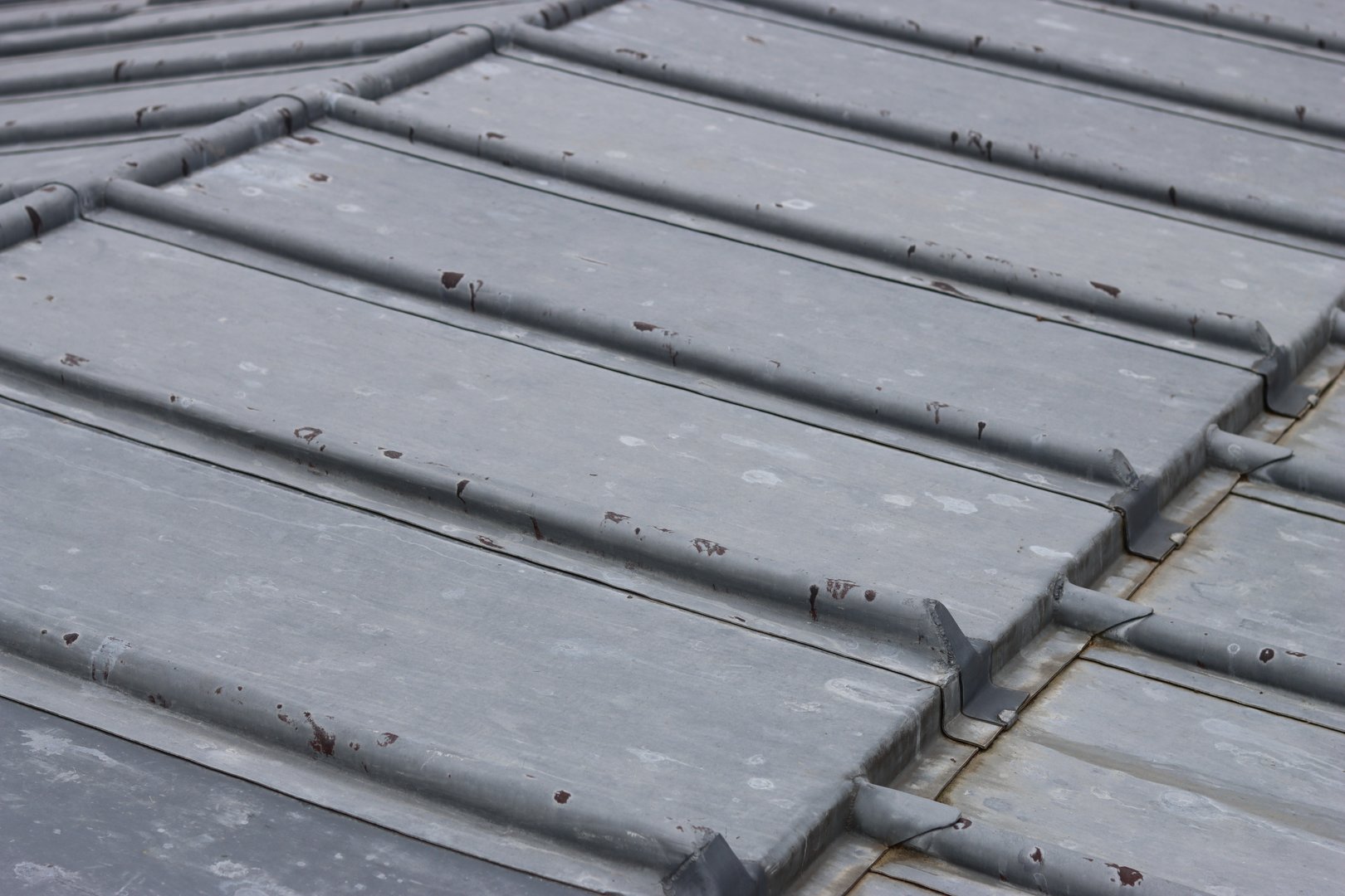 Strips of lead flashing neatly lining a roof