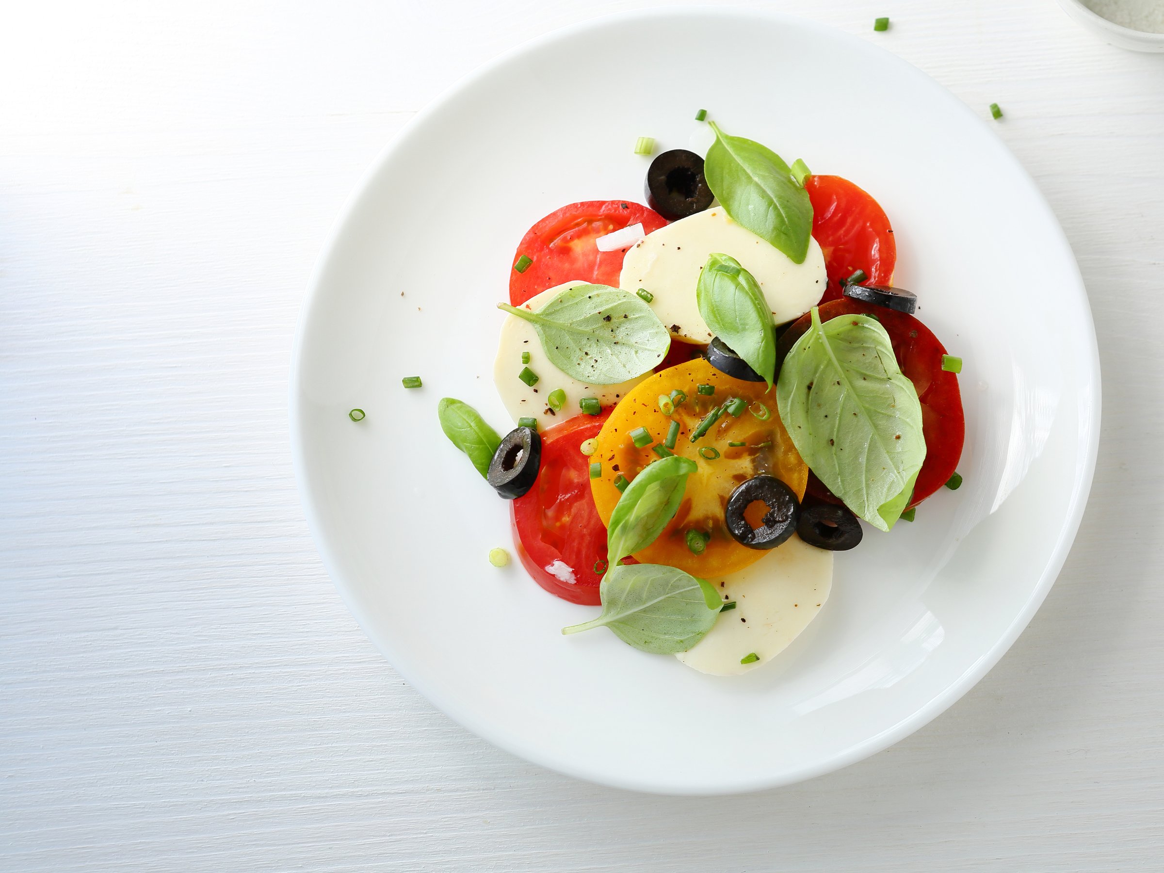 tomato salad on plate, food top view