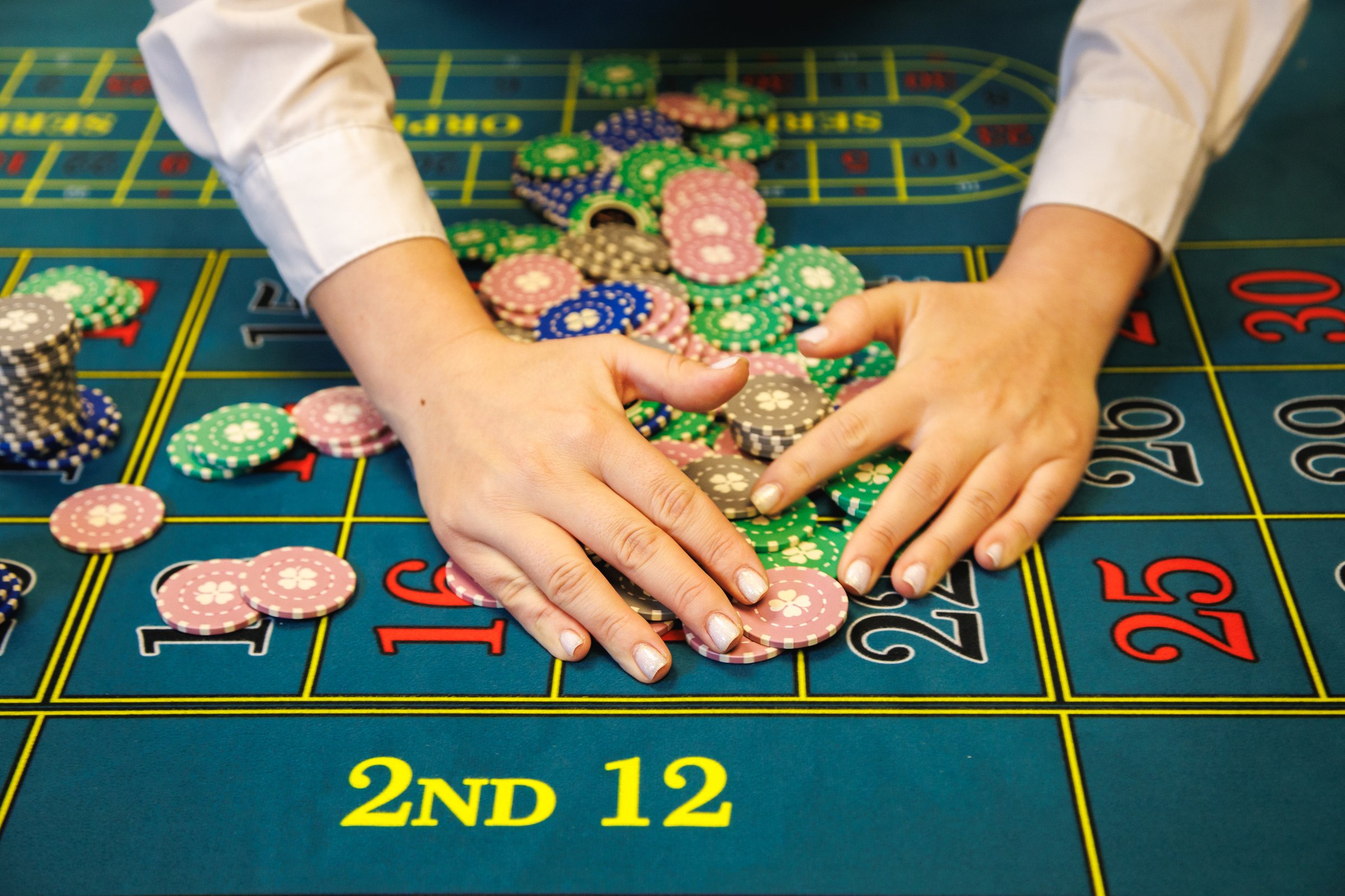 Mid-range quality casino poker chips on felt table