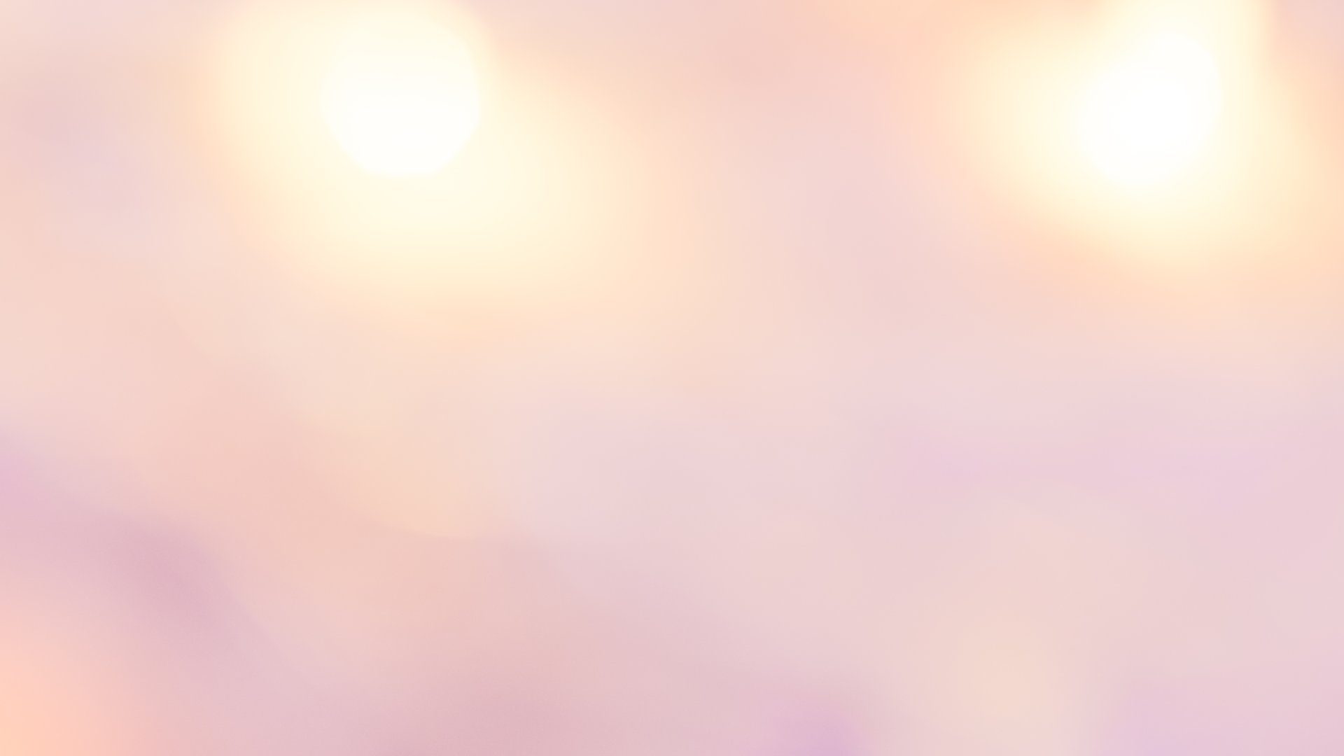 Soft golden pink gradient background with a delicate summer glow