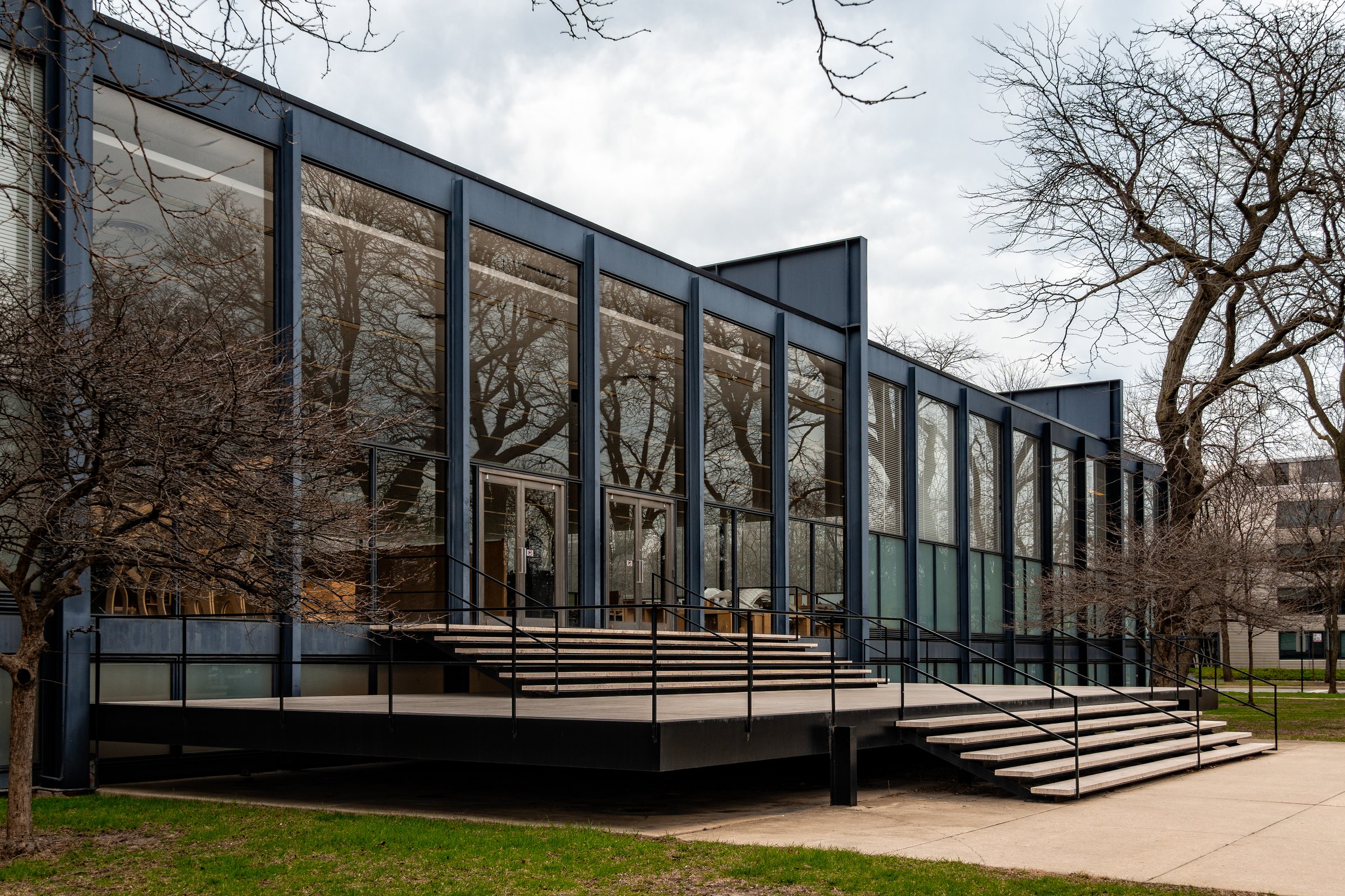 Chicago, USA - April 13, 2025: A view of the exterior of Crown Hall at the Illinois Institute of Technology, designed by Mies van der Rohe. The architecture is sleek and modern.