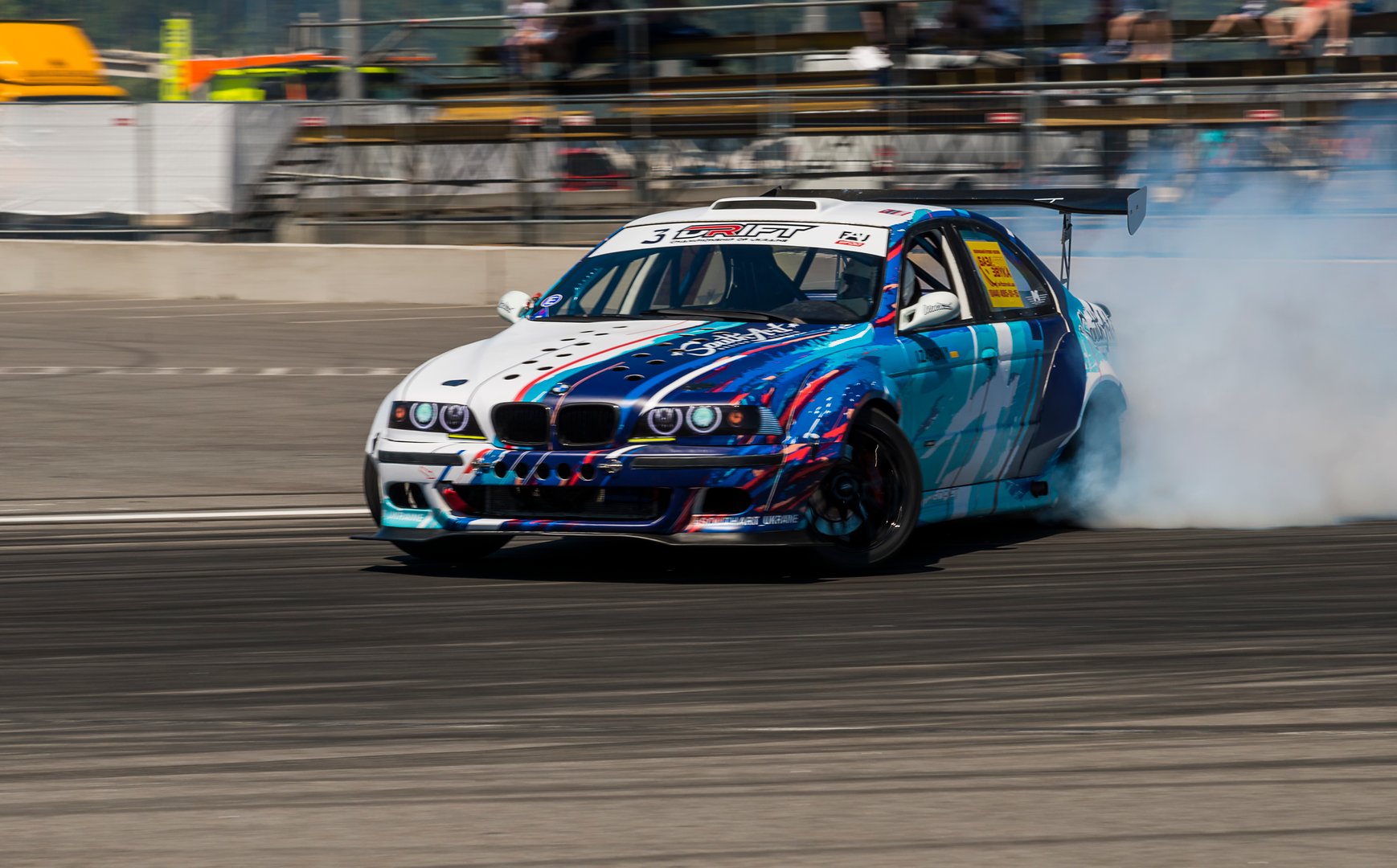 Lviv, Ukraine - June 6, 2015: Unknown rider on the car brand BMW overcomes the track in the championship of Ukraine drifting in Lviv.