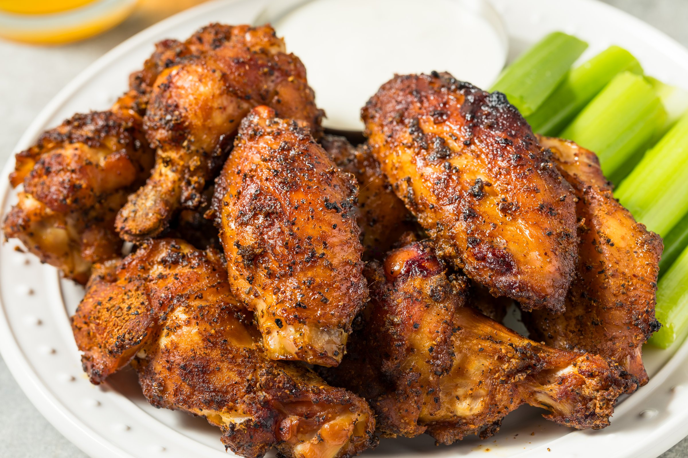 Homemade Smoked Buffalo Chicken Wings with Celery and Blue Cheese