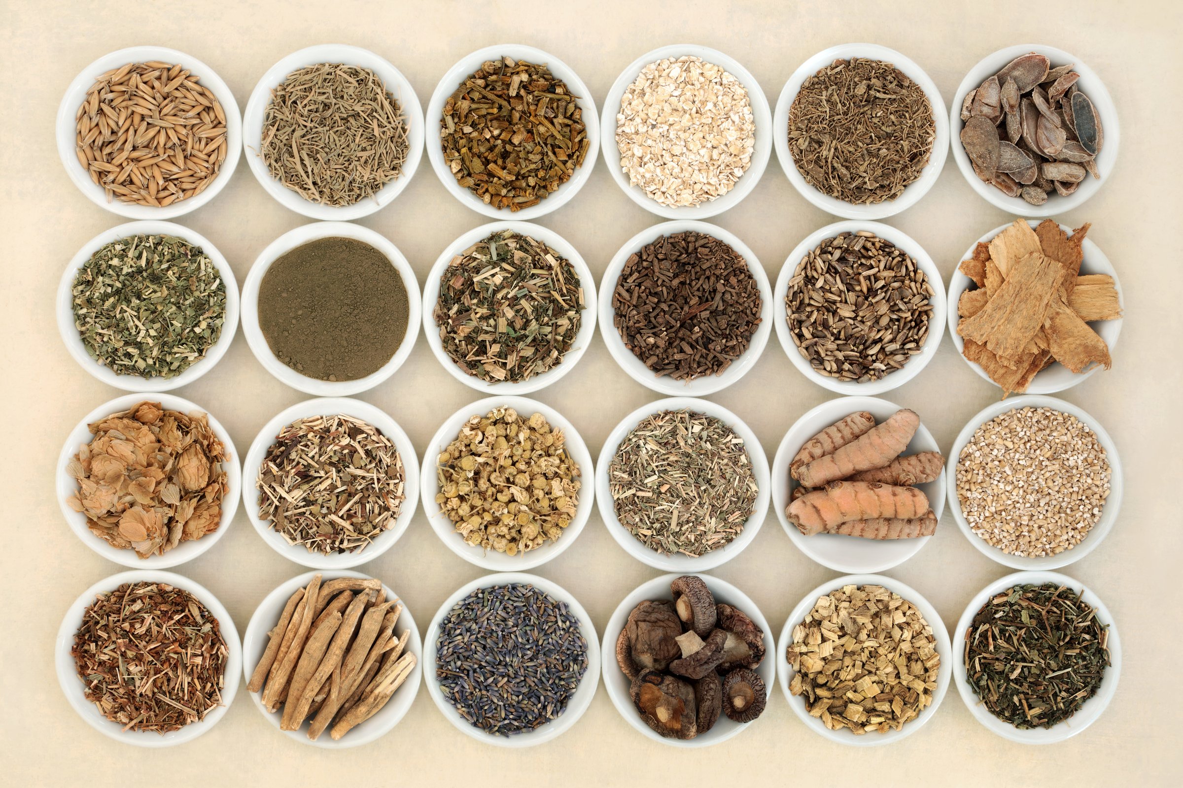 Nervine health food and herb collection in bowls. Heals the nervous system calms anxiety and stress. Healthy natural adaptogen alternative health care. On hemp paper.