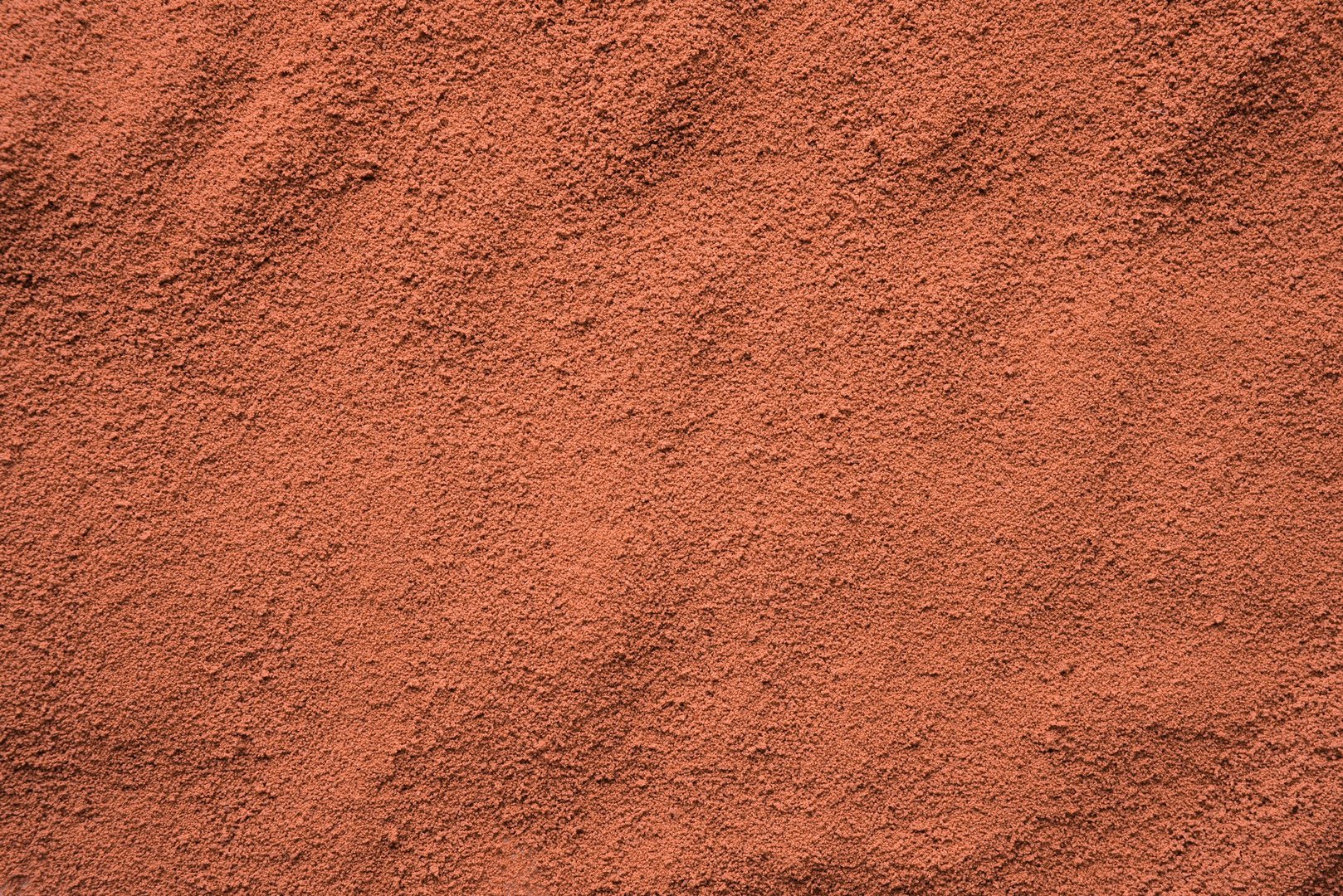 Abstract background photograph of hot chocolate cocoa powder. Close up.  Top view.