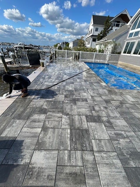 Pool paver installation near completion