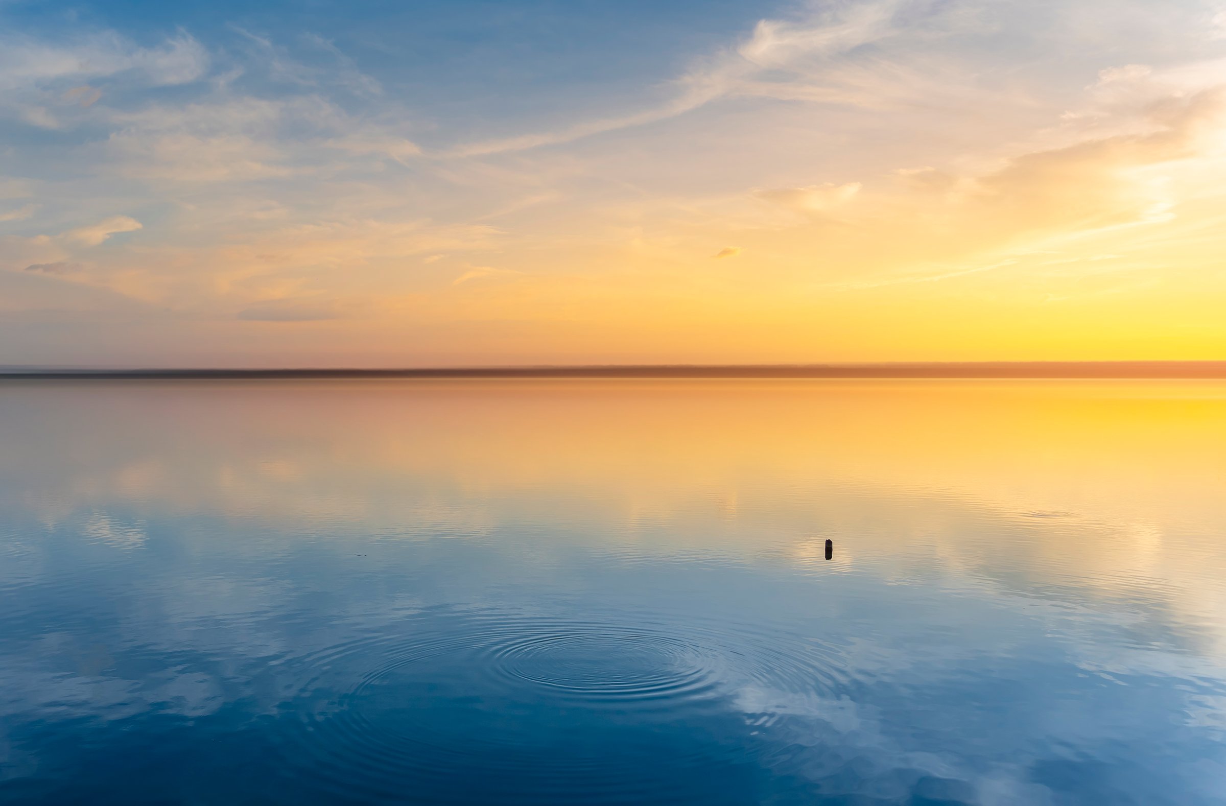 Water surface and sky reflection, calm nature. abstract background, web banner.