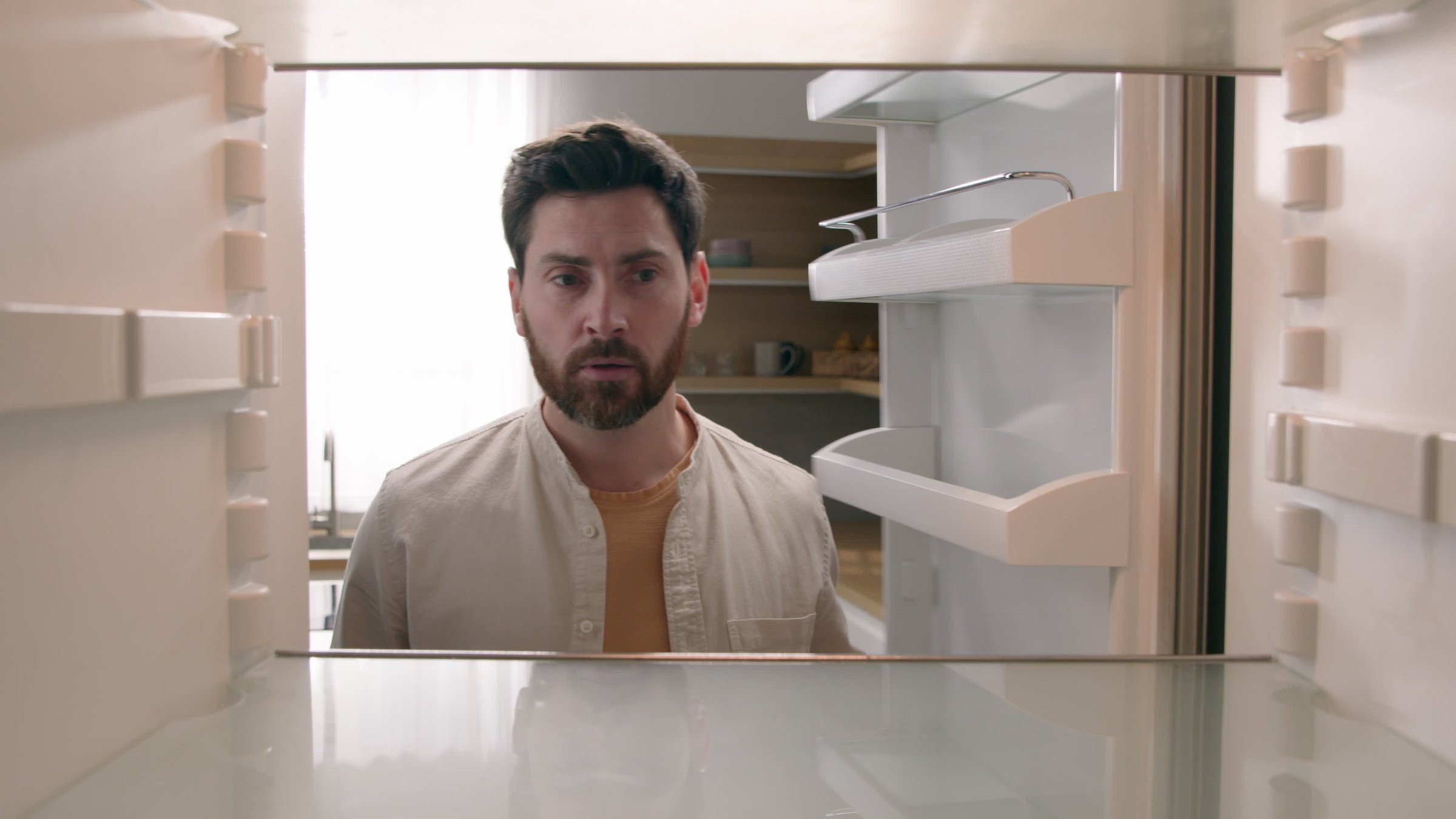 POV point of view from inside refrigerator Caucasian hungry man adult sad upset disappointed male guy looking for good twice open empty fridge no food without products crisis delivery supermarket. High quality 4k footage