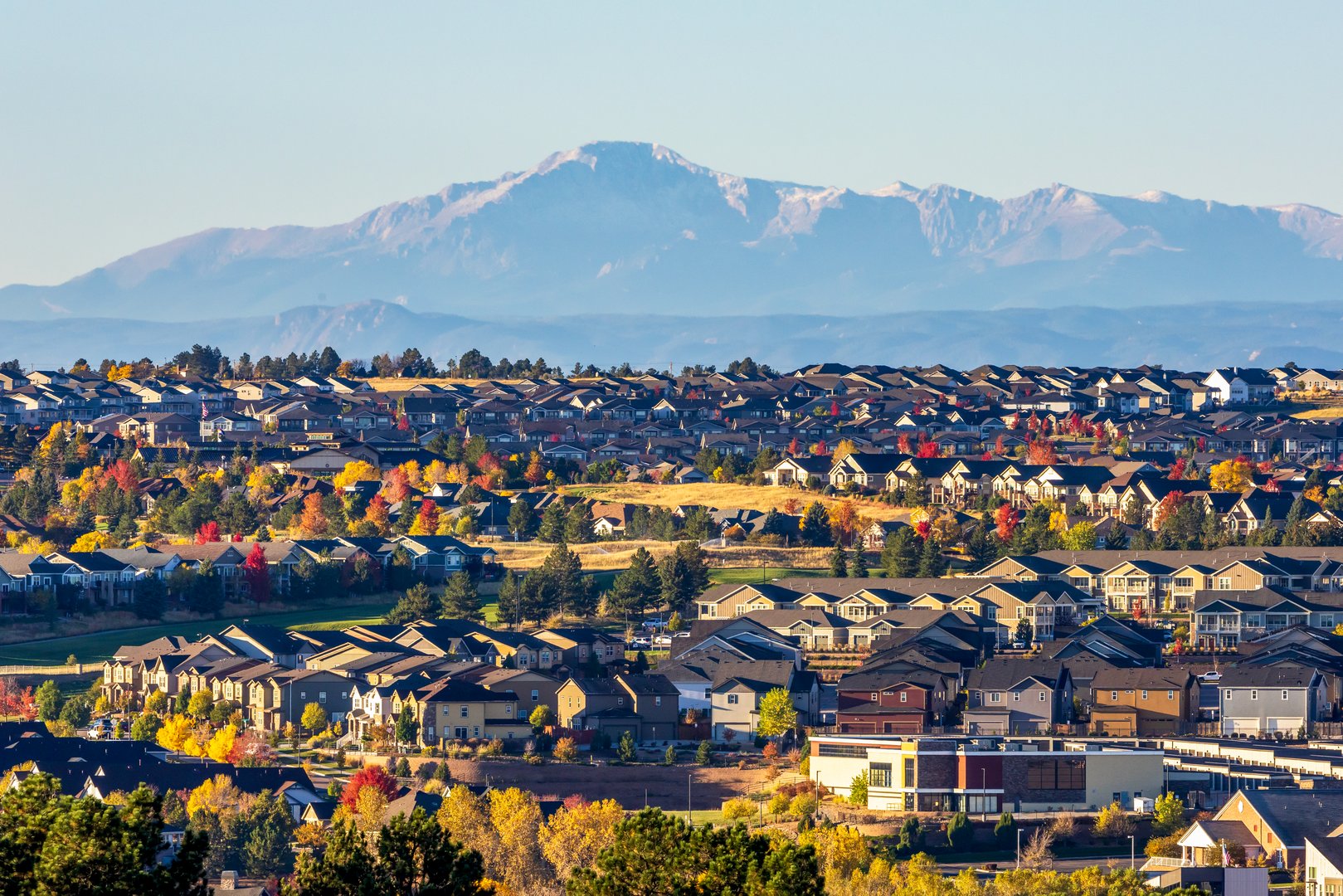 Henderson Nevada residential neighborhood with mountain views and desert landscaping showing VA loan eligible single-family homes in master-planned community with palm trees and modern architecture