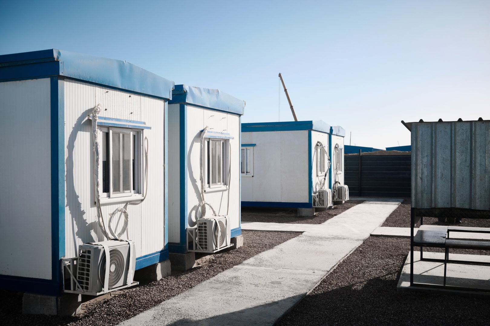 Mobile industrial buildings. Row of single-storey prefabricated industrial buildings.