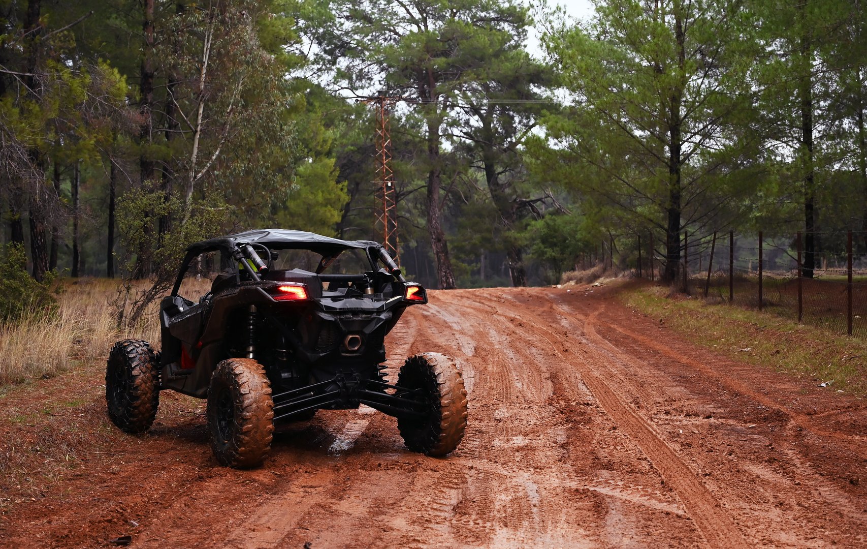 Offroad in the forest with UTV in the rain