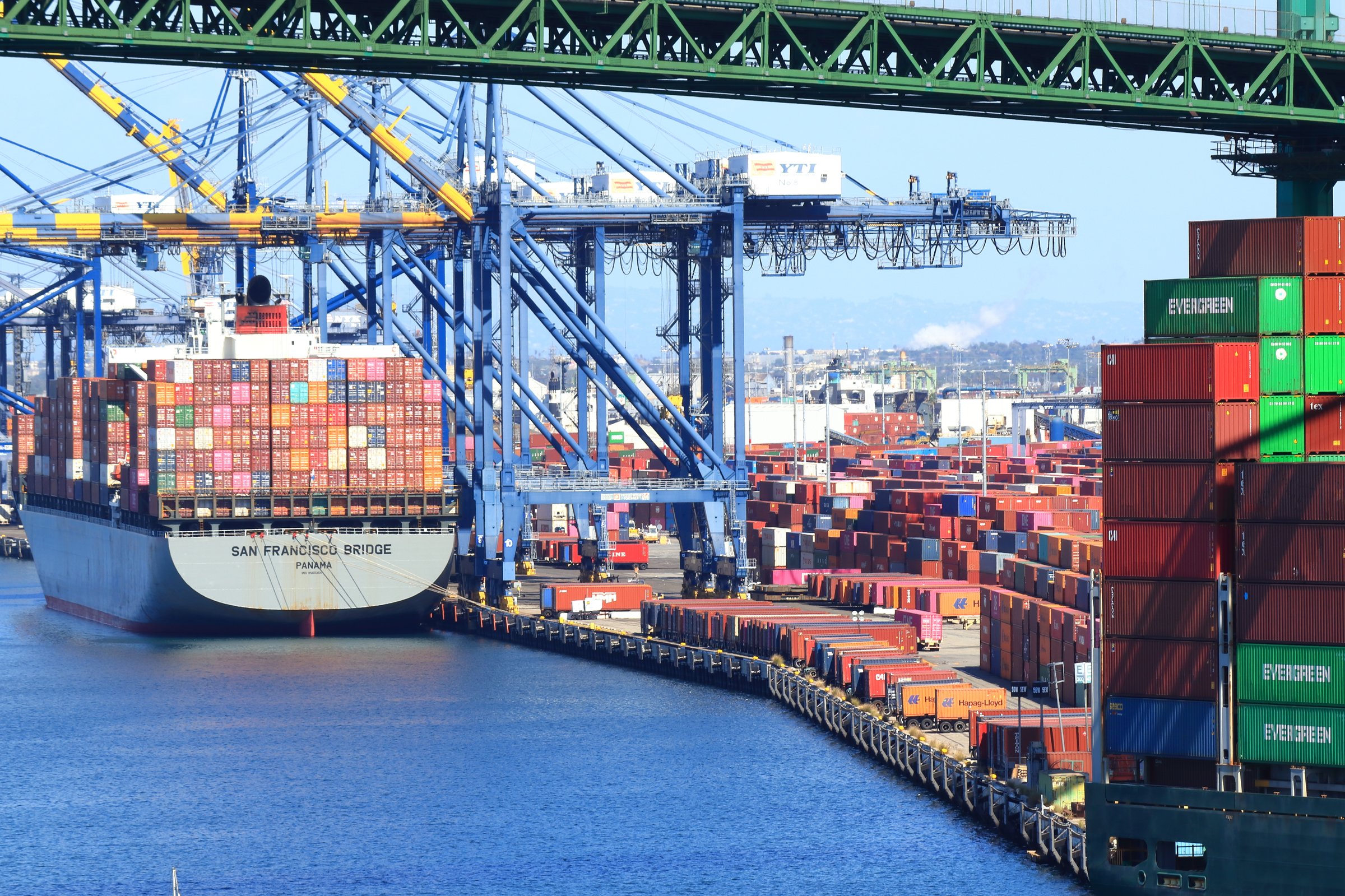 Los Angeles, California, USA - October 9, 2021: Cargo Containers being offloaded at the Port of Los Angeles