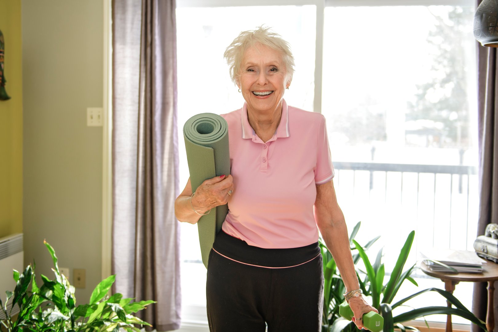A Portrait of nice senior training at home