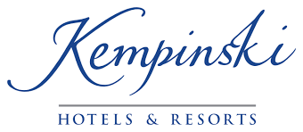 Kempinski Hotels & Resorts logo with elegant blue script and a gray underline.