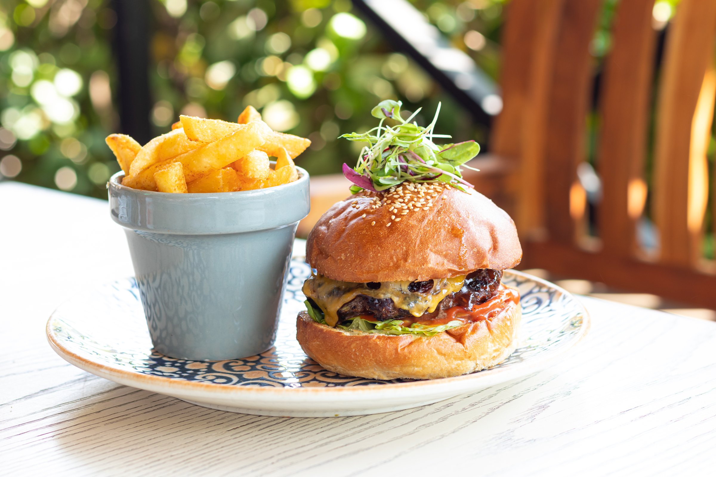 Burger and fries at an outdoor restaurant