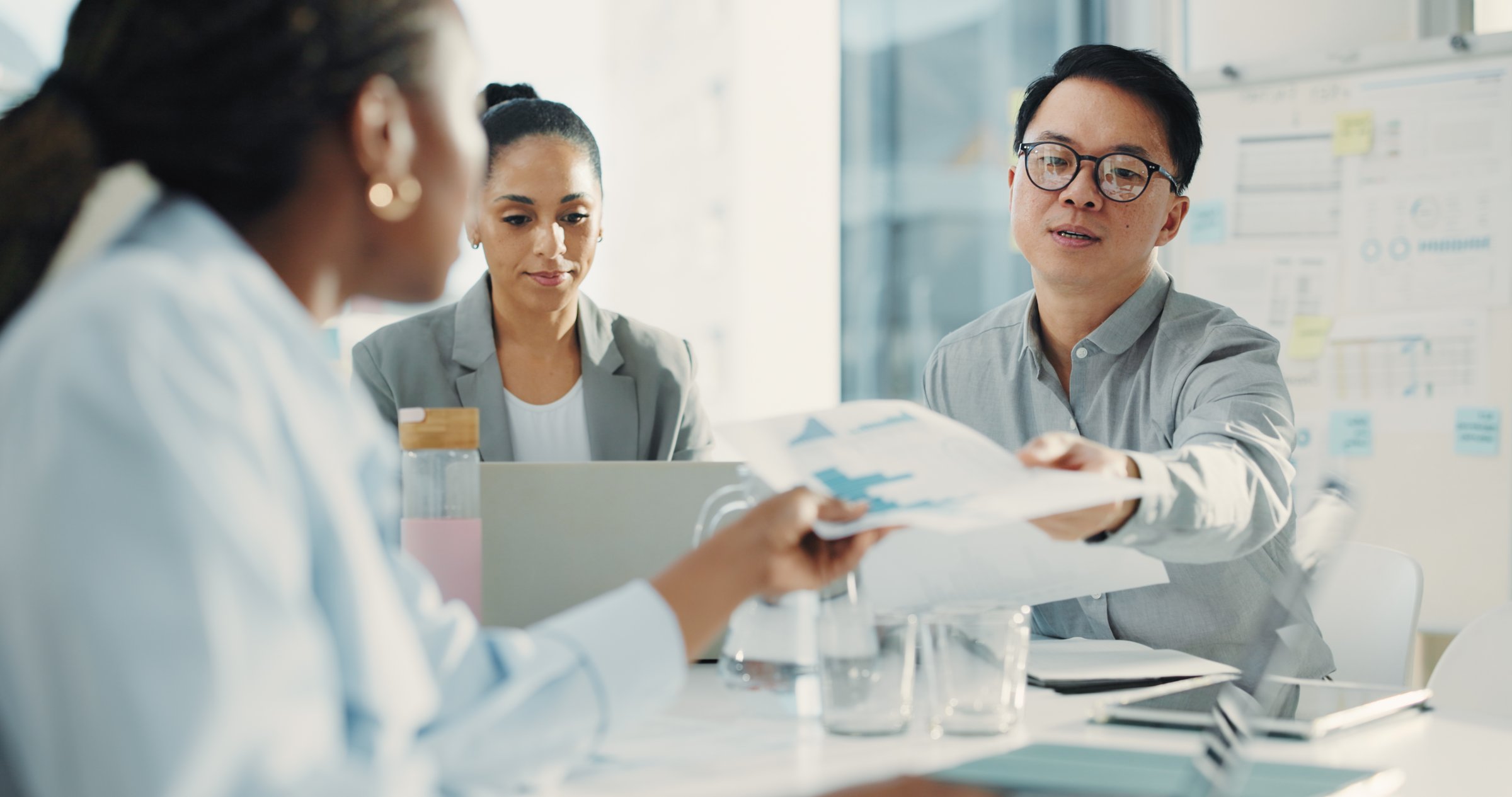 Meeting, documents and team with business people in office