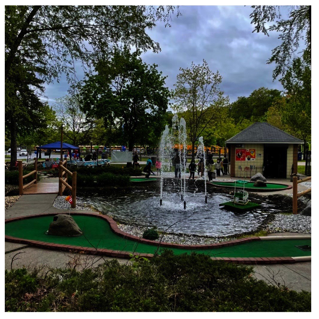 Close-up view of challenging mini golf hole with creative obstacles