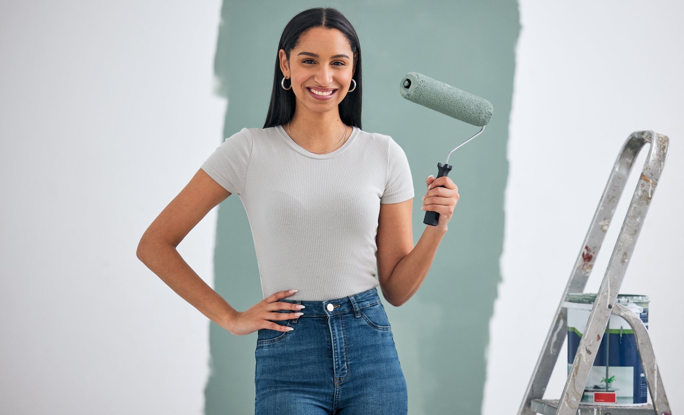Home renovation, green paint or woman painting for room interior wall or creative maintenance project