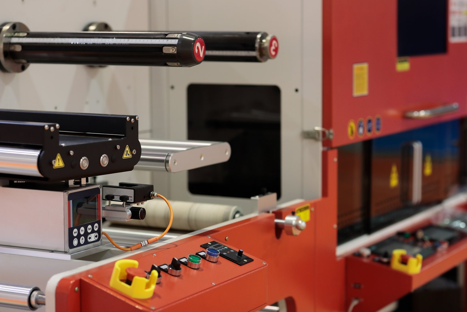 Automatic adhesive label laser cutting machine close up. Selective focus.