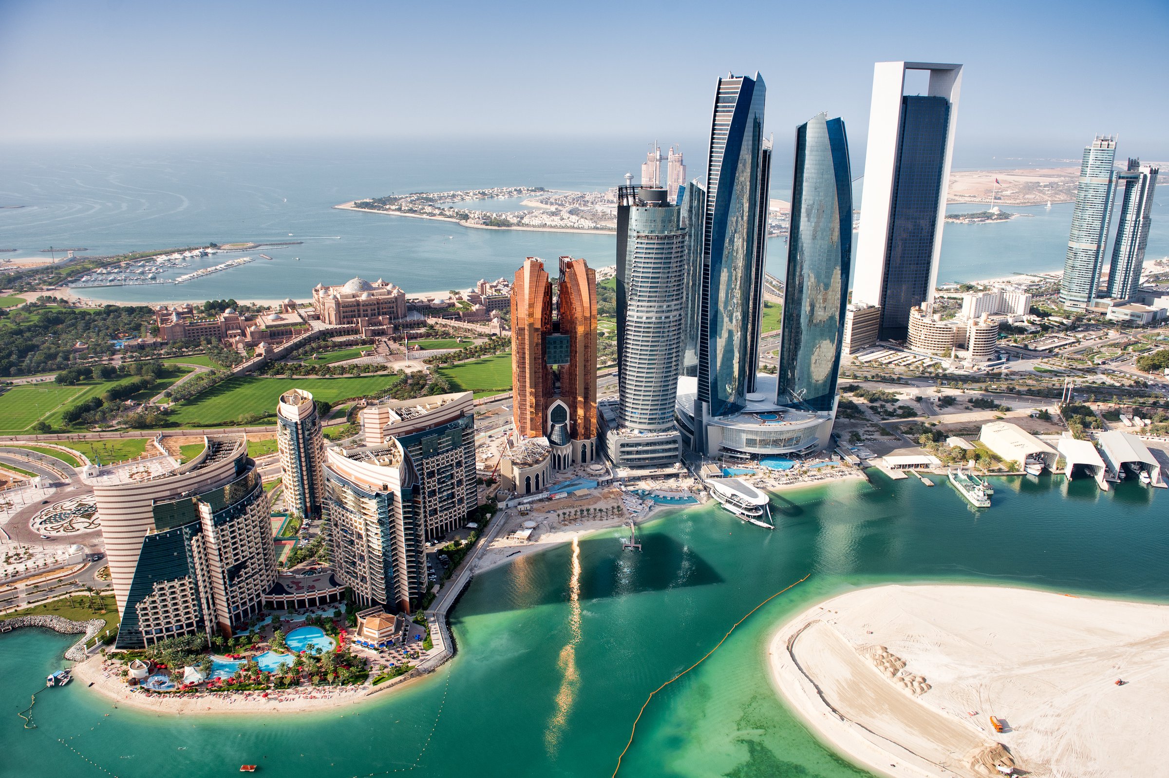 Stunning Abu Dhabi skyline with Etihad Towers & luxury waterfront. Crystal clear waters, pristine beaches & modern UAE architecture. Desert oasis.