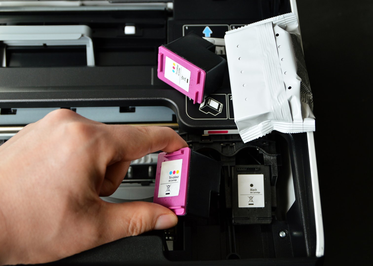 Replacement of used printer cartridges with new cartridges.
