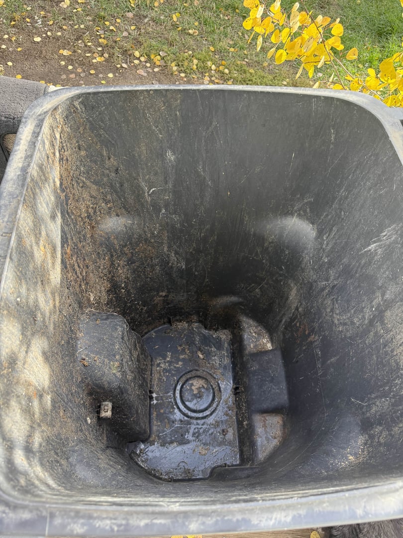 Dirty trash bin before cleaning