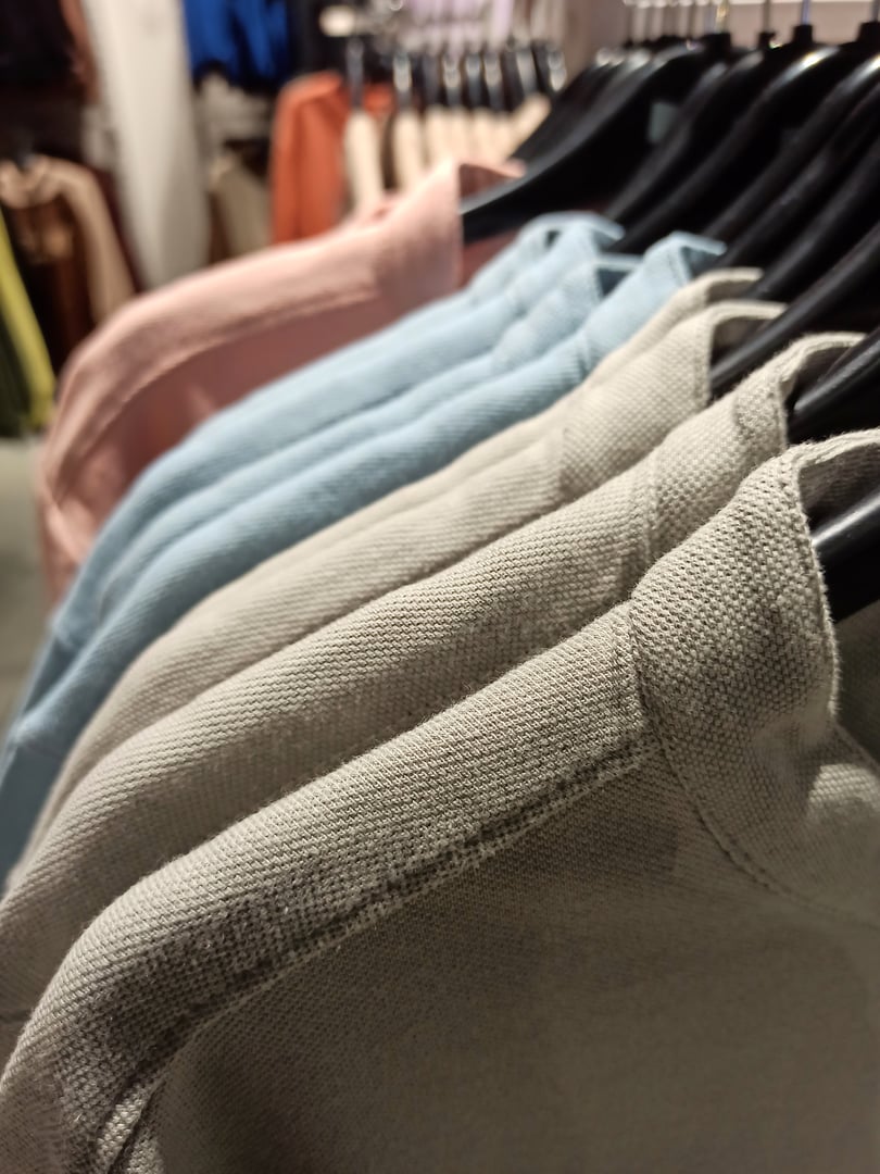 Multi colored shirts on hanger for sale