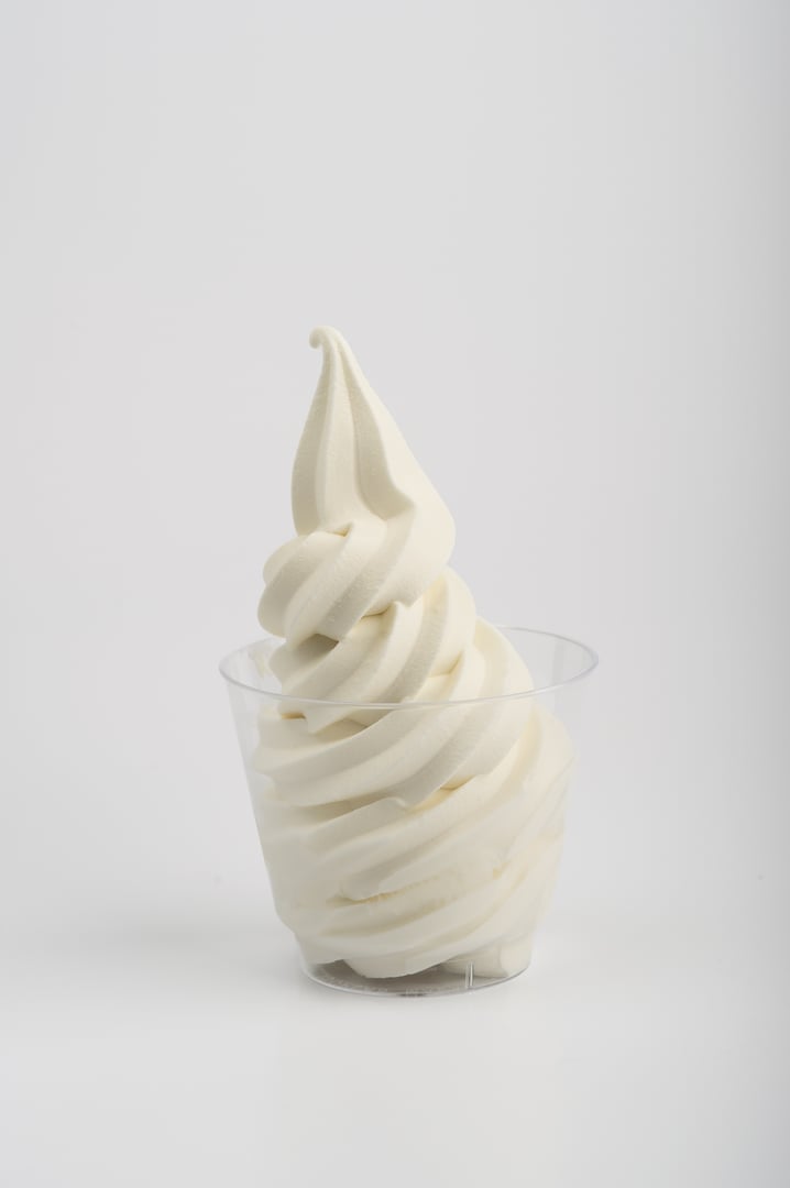 Vanilla soft serve in clear cup isolated white background hd high res frontal view