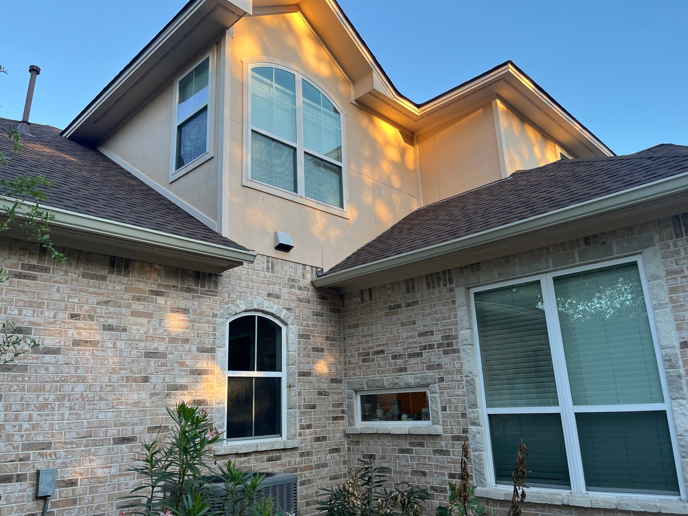 Professional house washing service showing clean home exterior