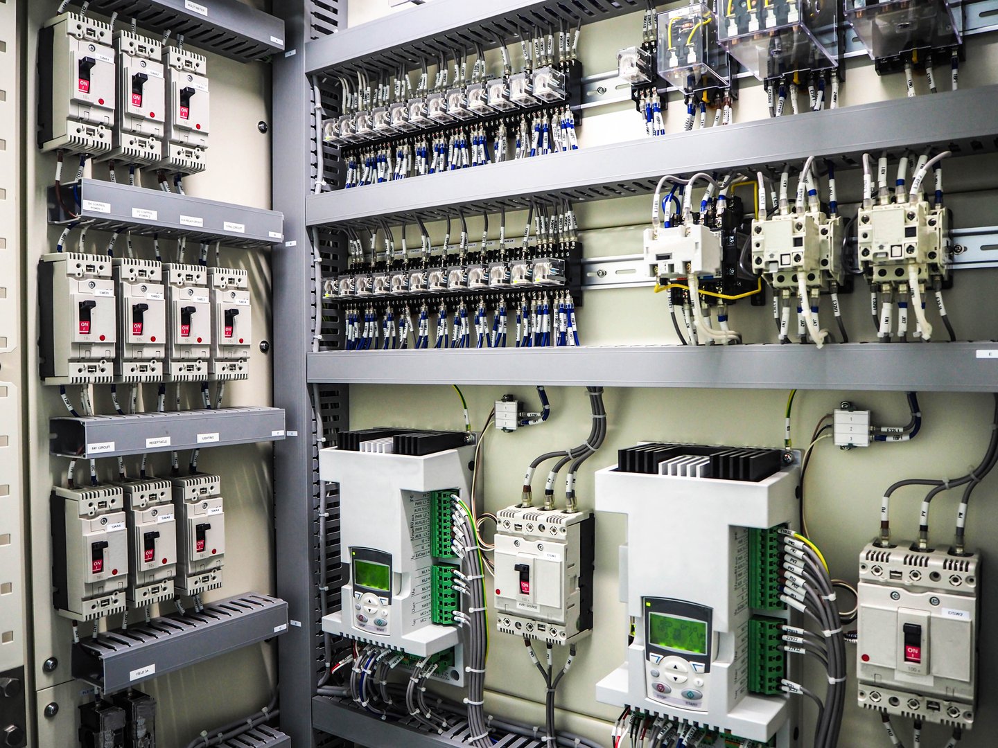 Electrical breaker inside electric panel in power plant.