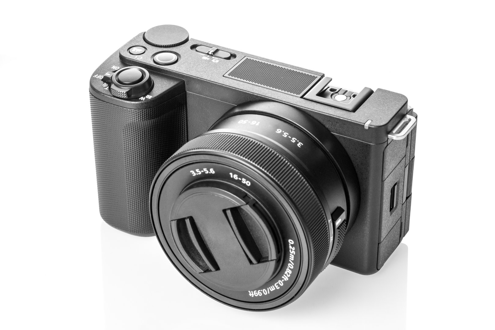 Modern digital small mirrorless photo and video camera isolated on white background.