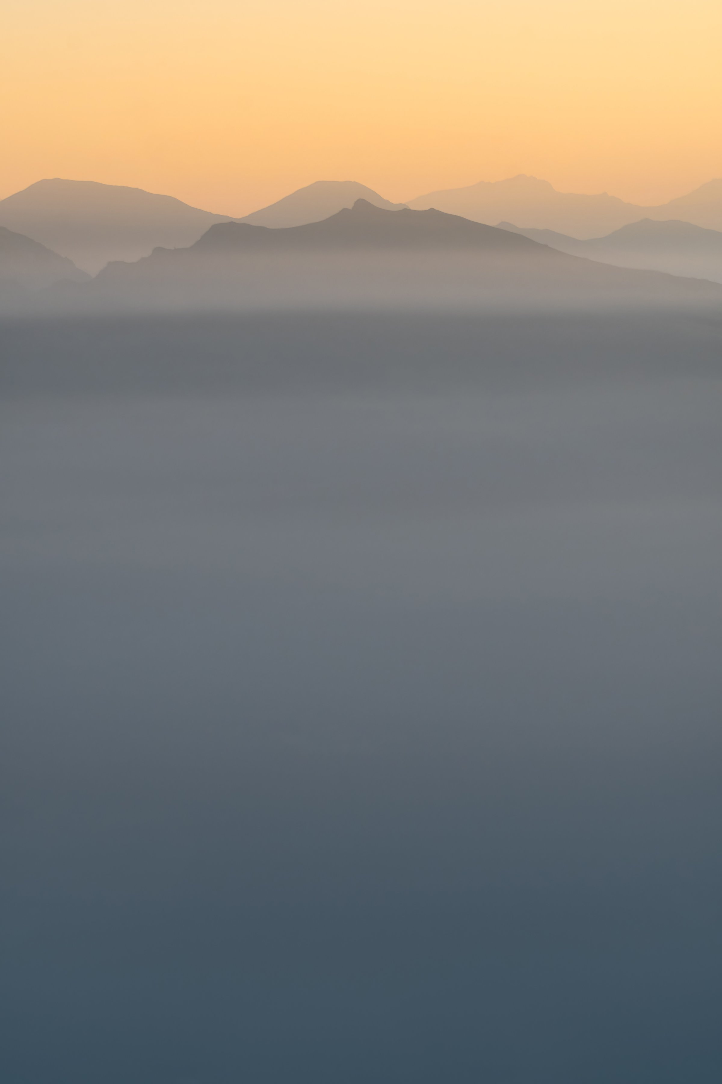 Minimalistic landscape photography of the Italian Dolomites during sunrise from Passo di Monte Giovo aka Jaufenpass, pastel colours, minimalism, copy space, negative space