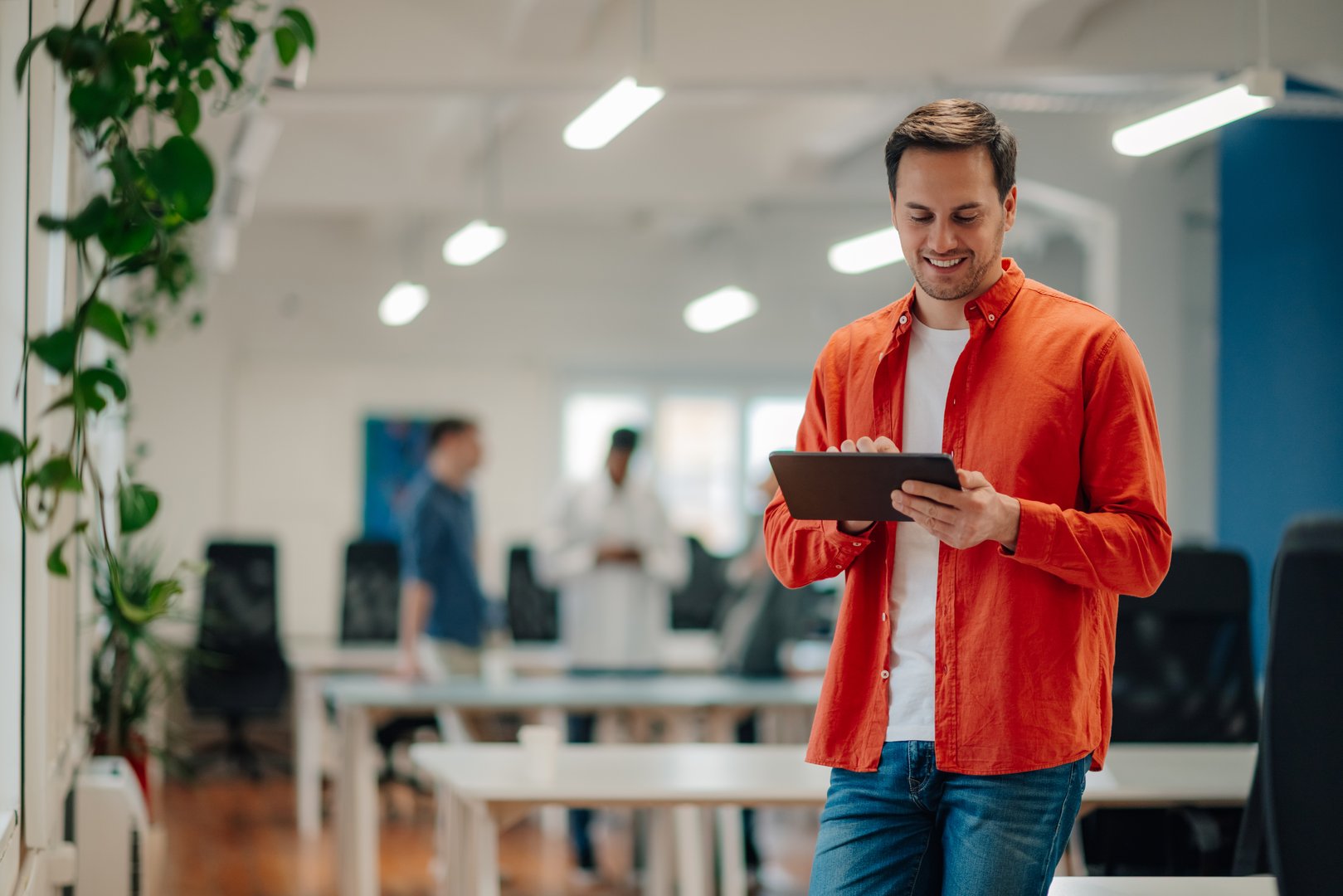 Startup business manager using digital tablet in modern office