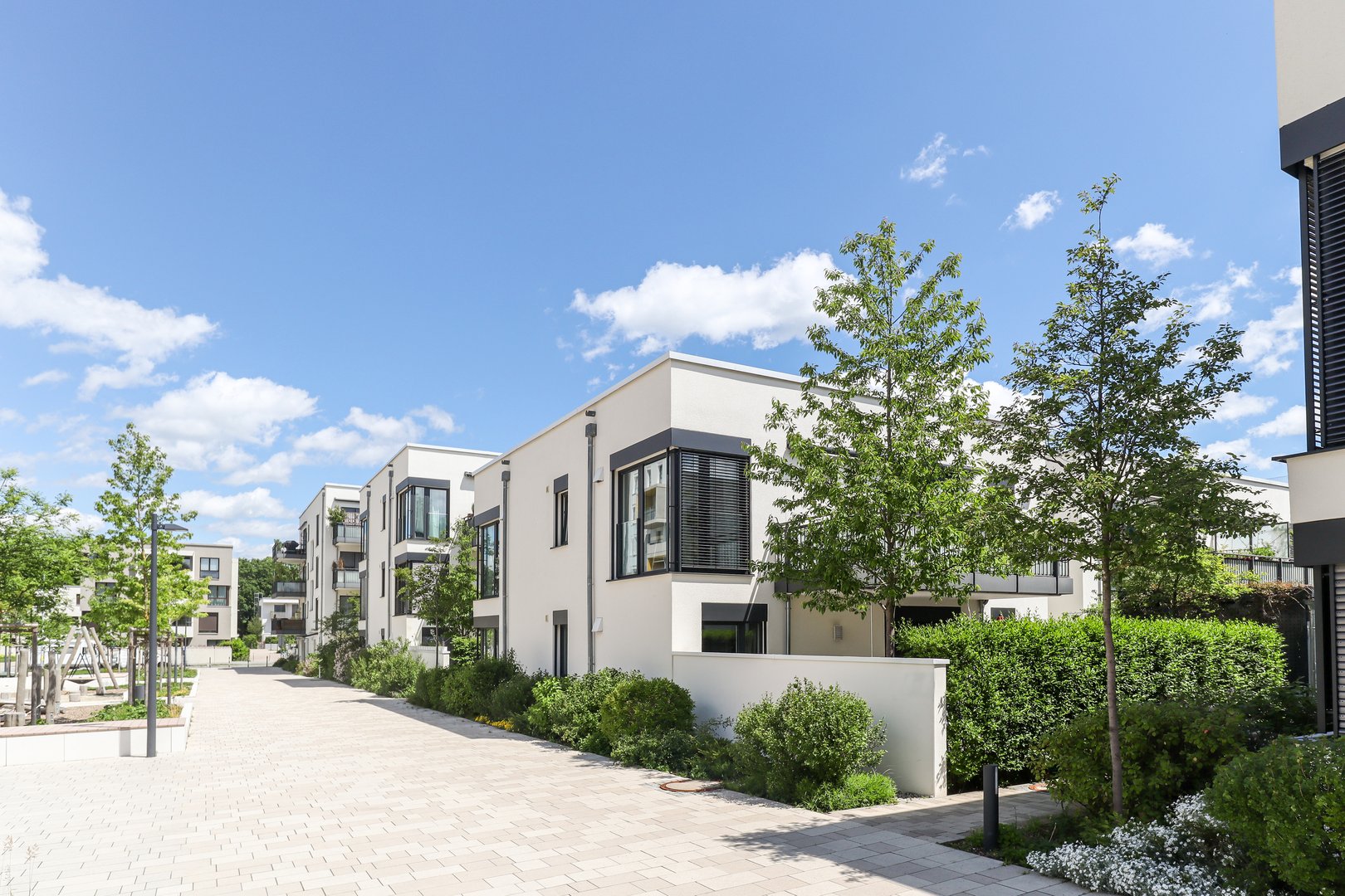 Residential area with ecological and sustainable green residential buildings, low-energy houses with apartments and green courtyard