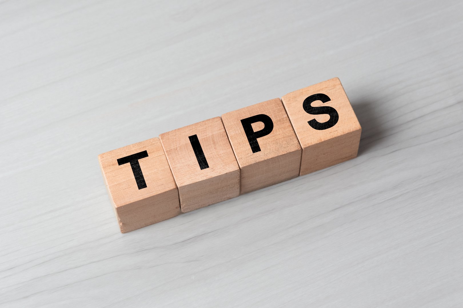 word tips on wooden cubes