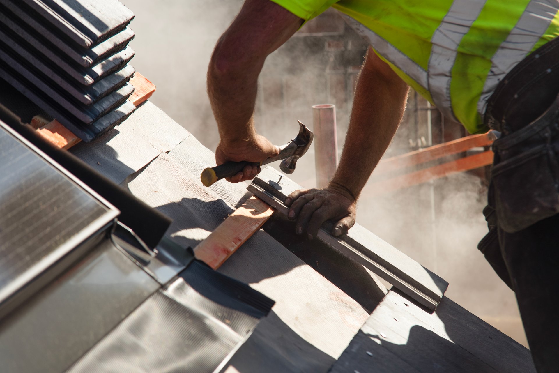Craftsman roofer builds new house roof from ceramic tiles