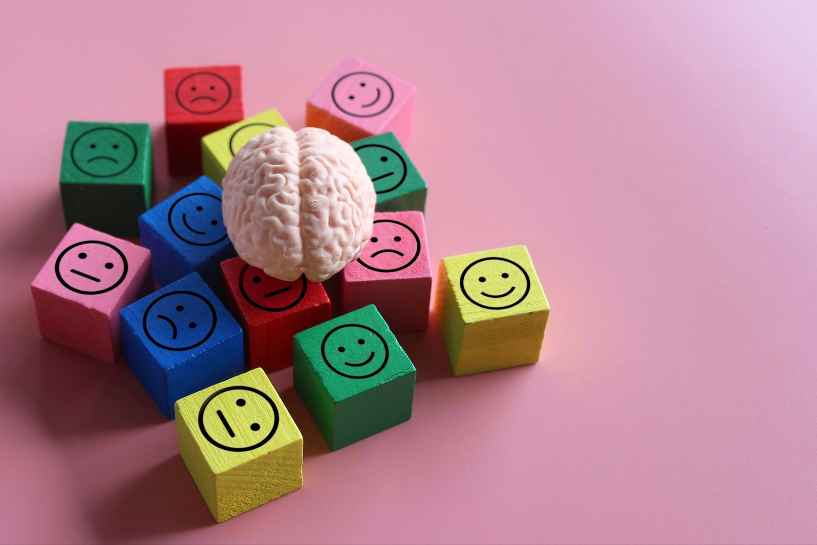 Human brain with happy, neutral and sad icon. Mental health, mood swings, bipolar disorder concept.