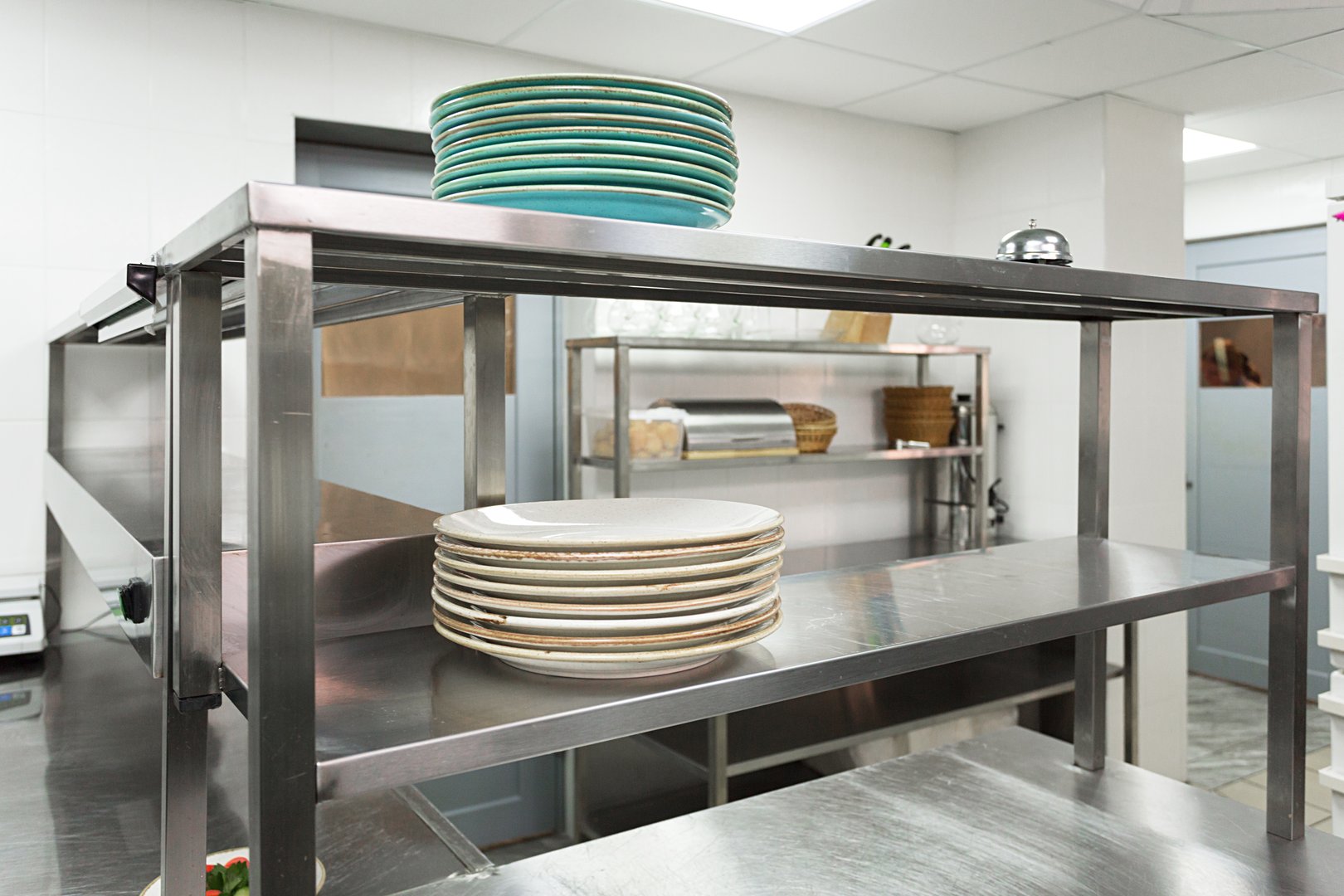 Clean restaurant kitchen with stainless steel surfaces