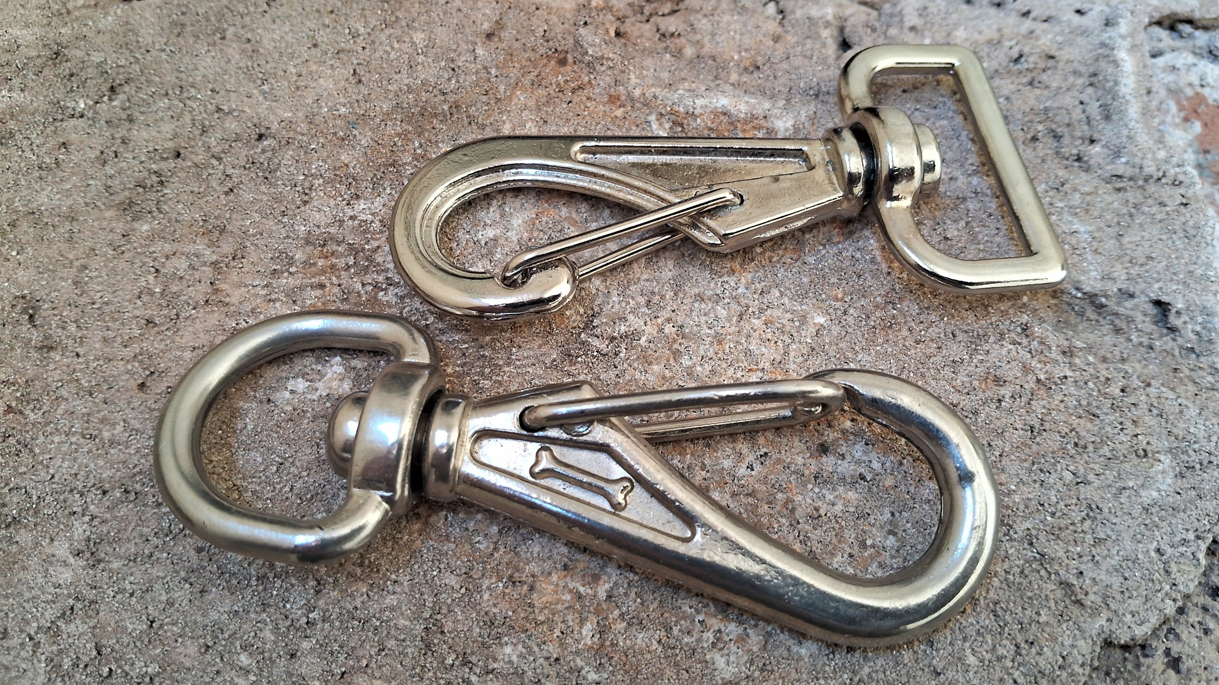 Metal rings and hooks on a concrete background
