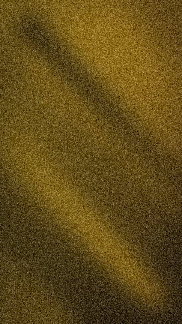 Rich and elegant abstract background with a dynamic light beam and deep shadow, featuring tones of dark mustard yellow and antique gold. Enhanced with a grainy texture