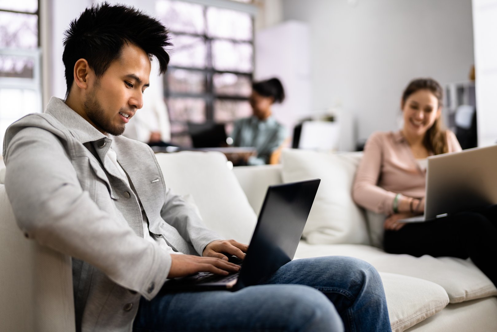 Young Diverse People Working In Coliving Space