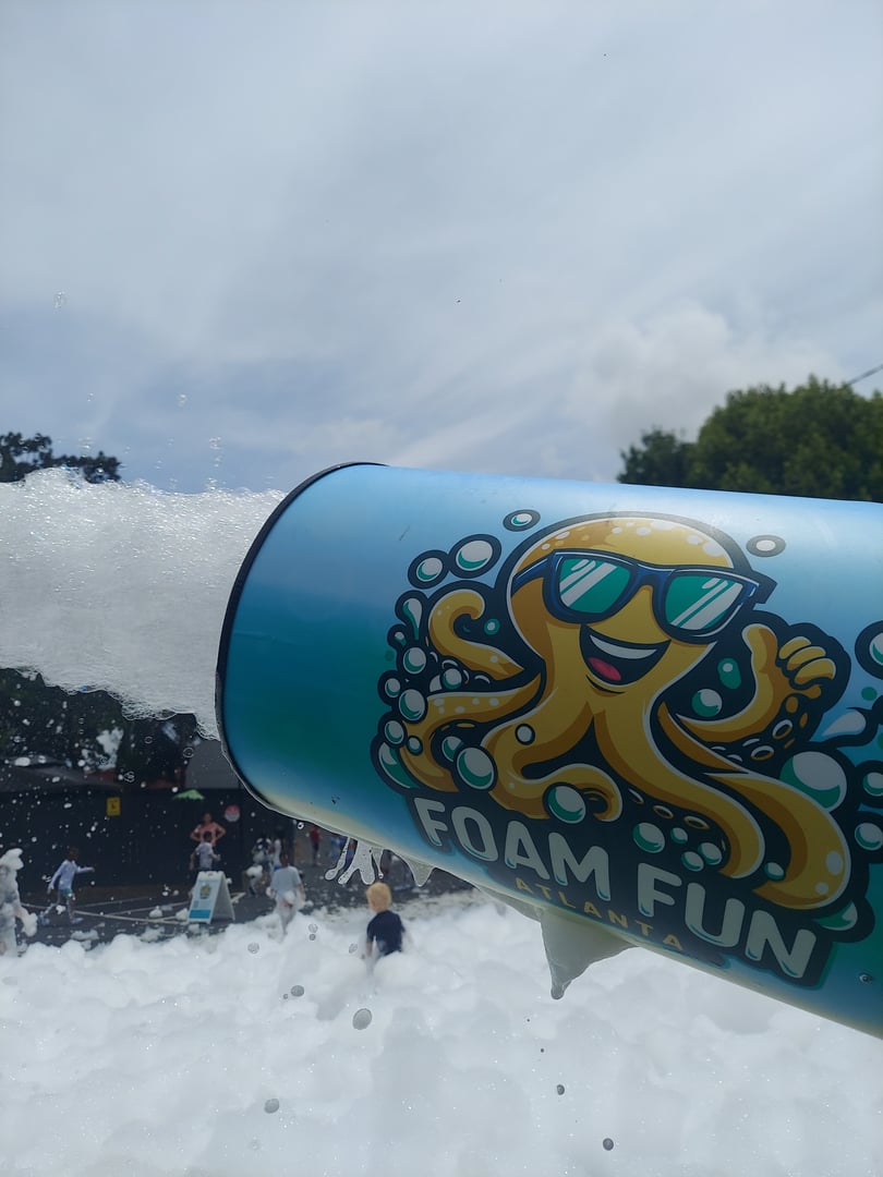 Children playing in foam at party