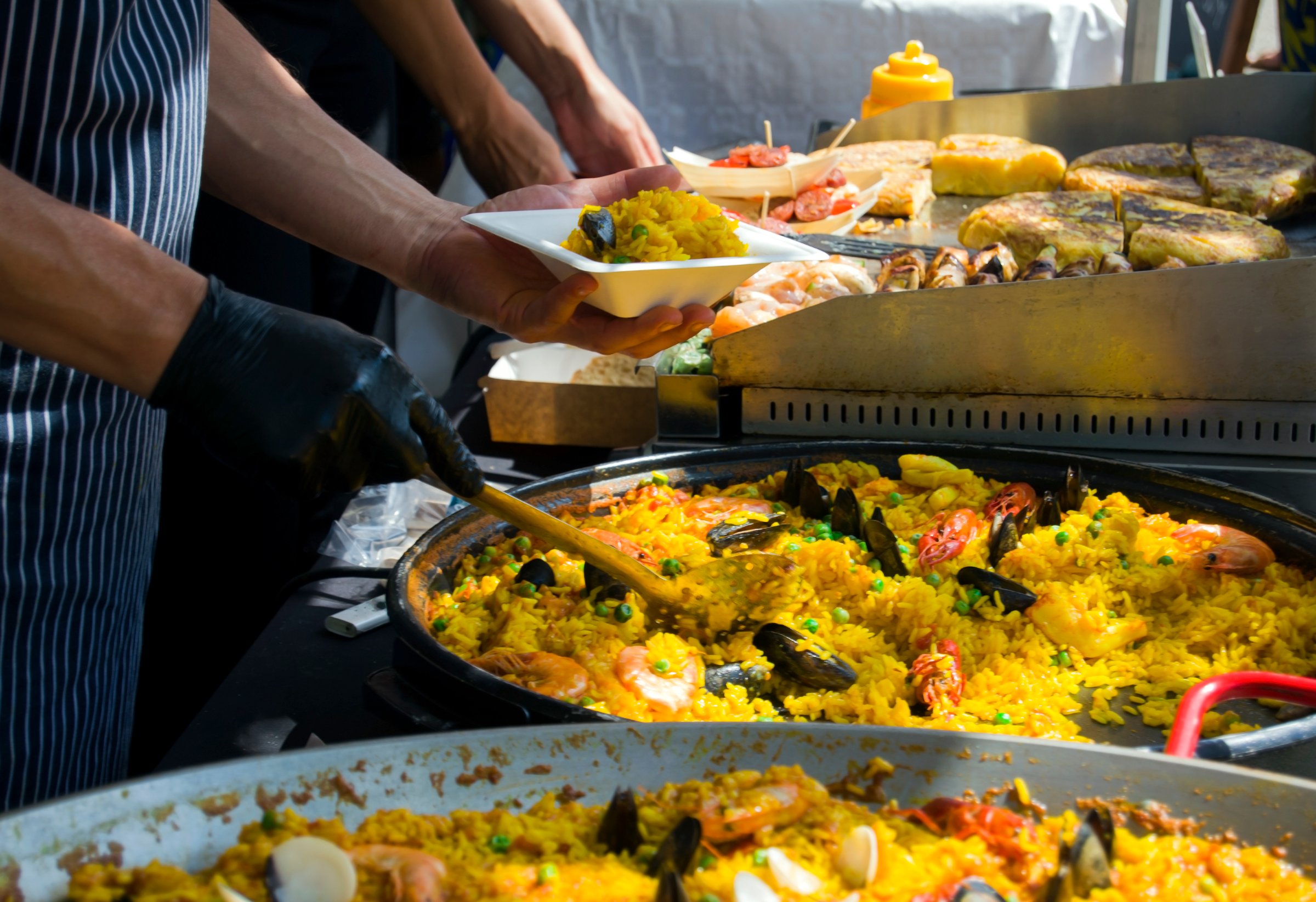 Spanish paella prepared in the street restaurant.