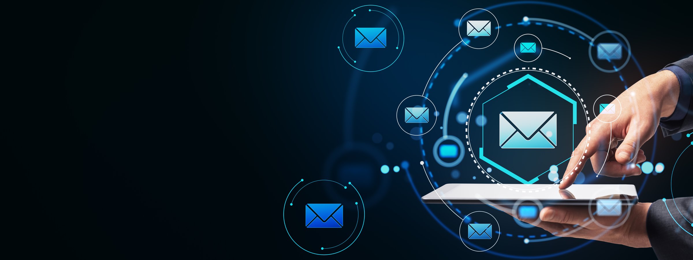 Email icons on tablet, dark background, digital communication concept