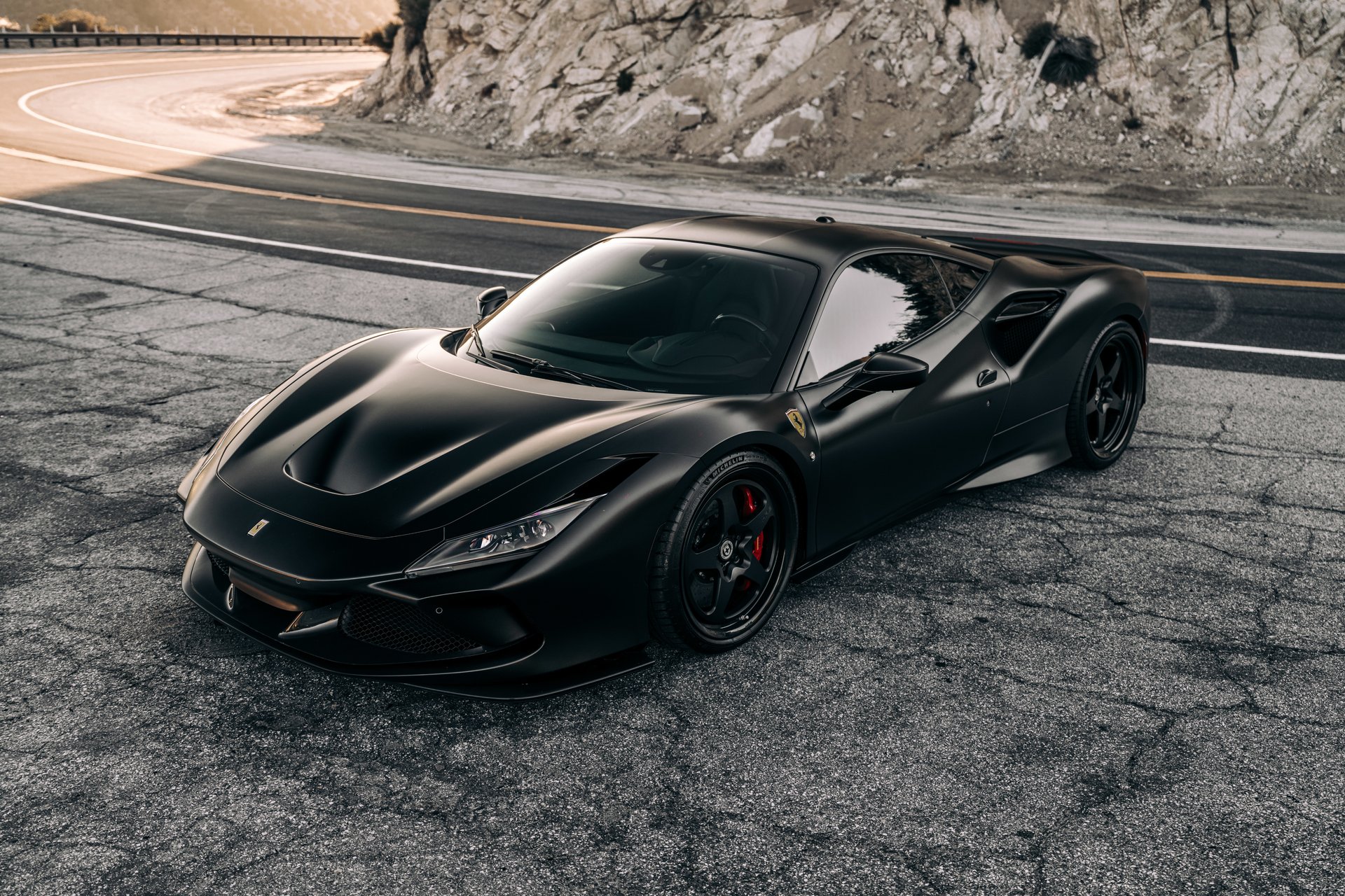 LA, CA, USAJanuary 28, 2025Black Ferrari F8 parked outside showing the front of the car