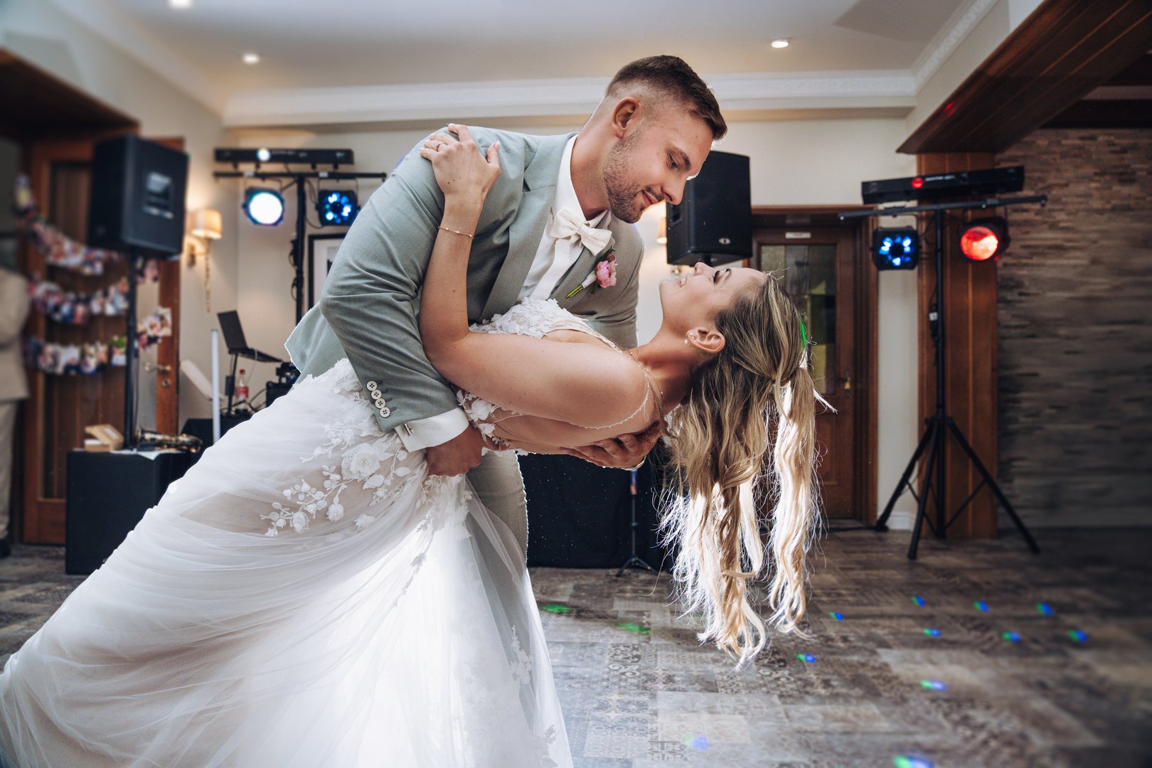 Happy couple sharing their first dance at a wedding reception