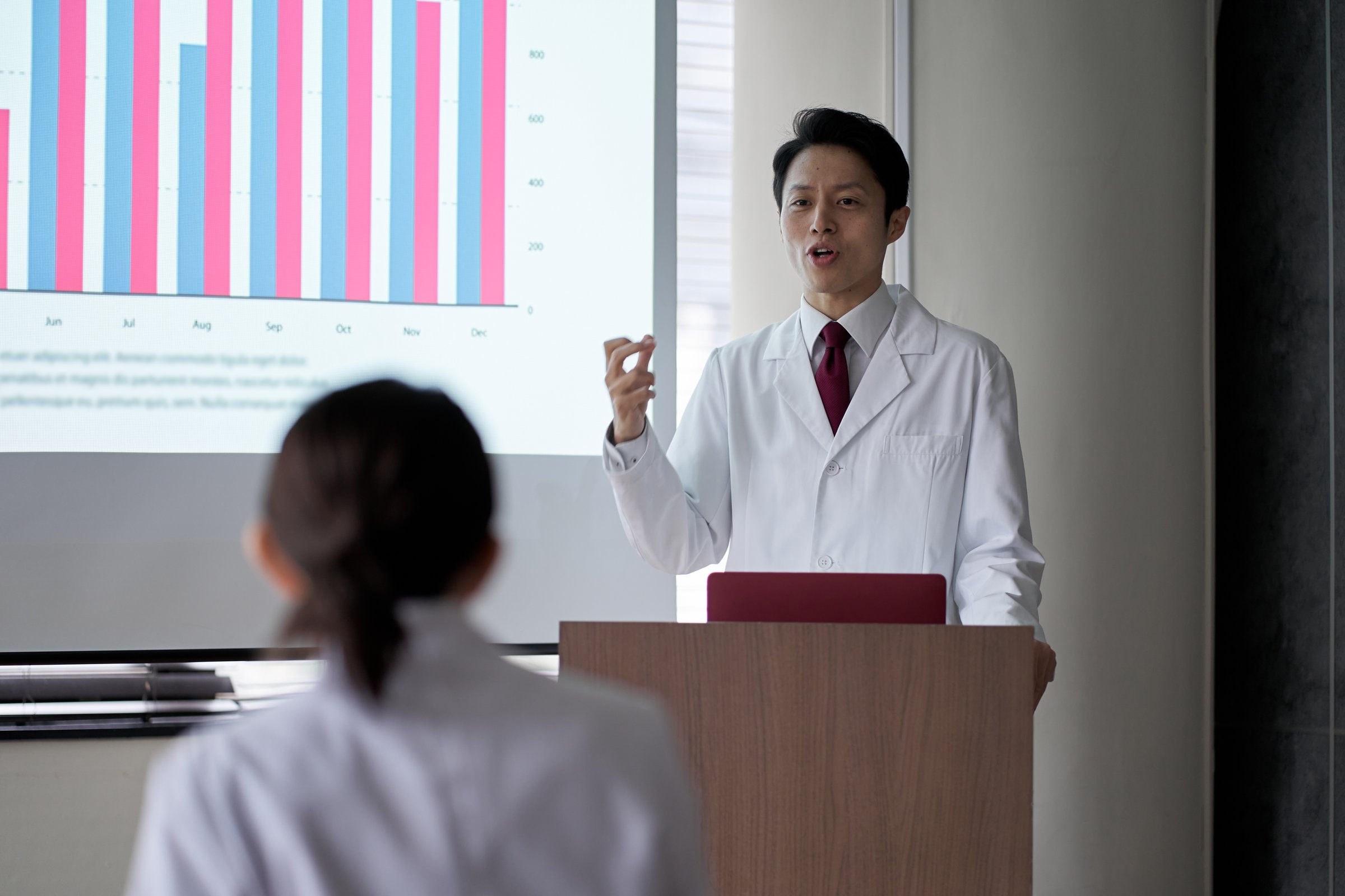 Medical personnel taking the stage at the seminar