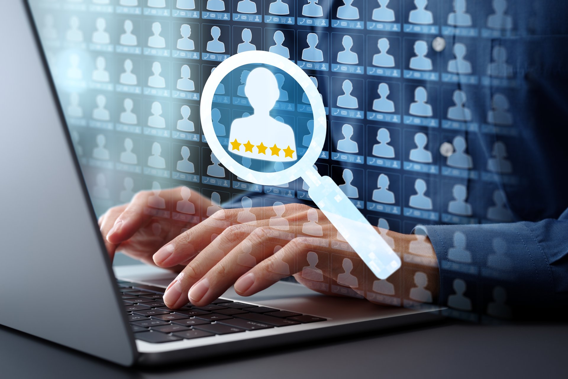 Searching customer management database for target and lead. Analytics and scoring of key client information. Businessman typing on laptop computer keyboard at desk in office.