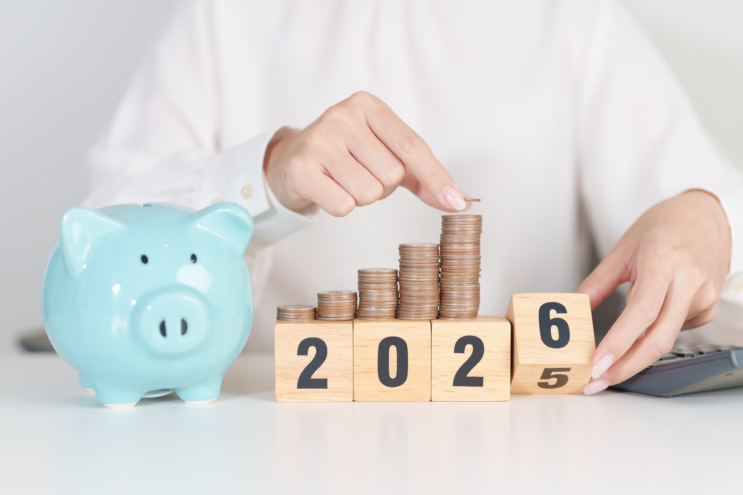2025 end year to Happy New Year 2026 with piggy bank. Resolution, Goals, Plan, Action, Money Saving, Retirement fund, Pension, Investment and Financial concepts
